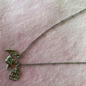 Silvertoned Necklace with multicharm(cage, bird and wing charms) pendant